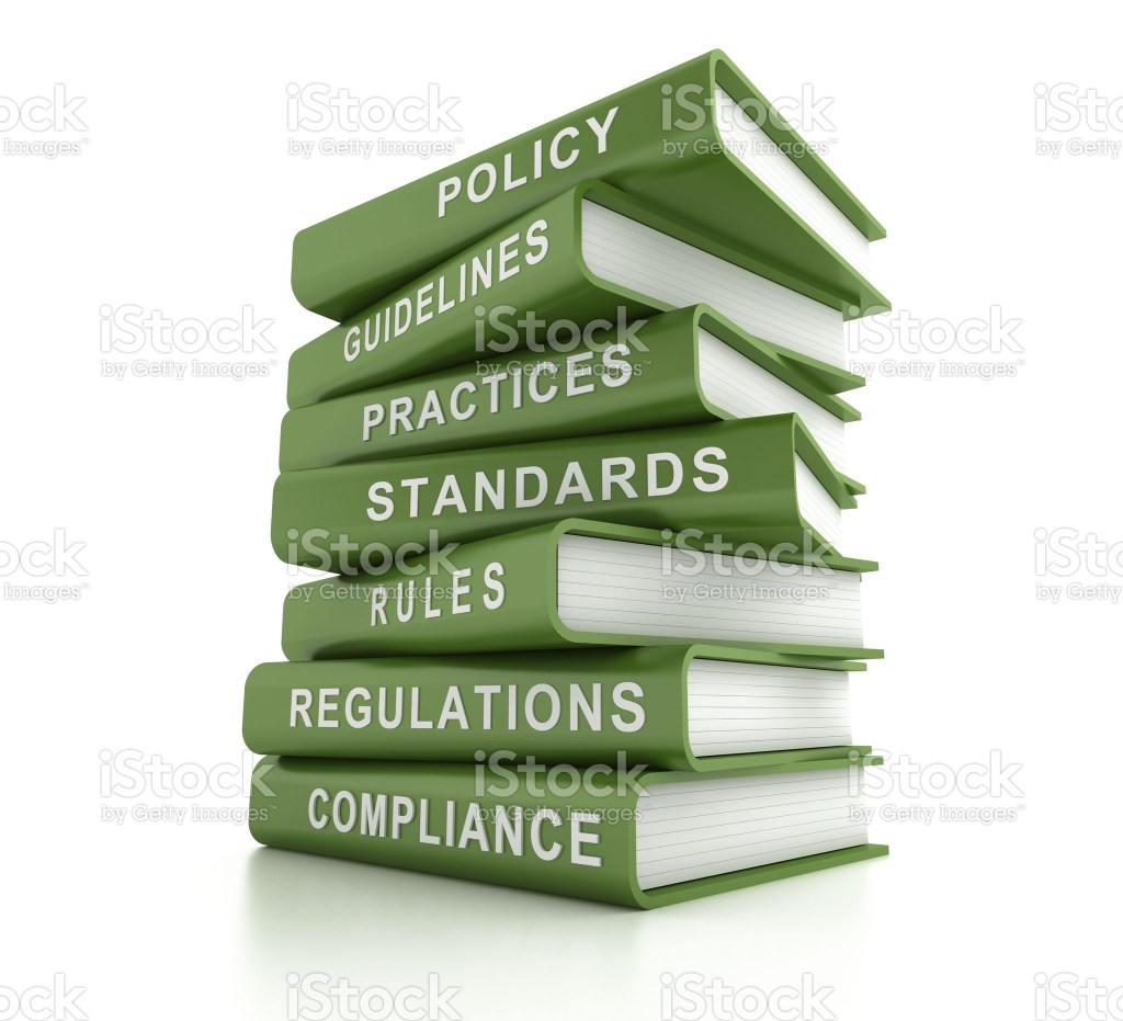 stack of green books, compliance and related words