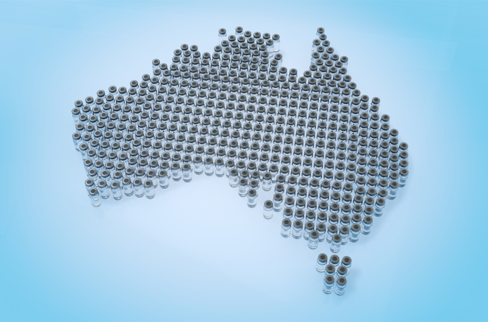 3D concept image of coronavirus COVID-19 vaccine vials lined up in a large group in the shape of Australia.