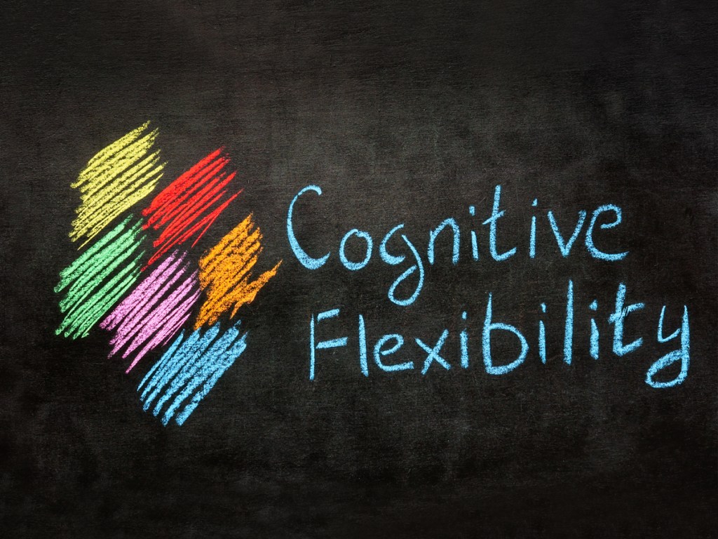 Handwritten inscription Cognitive flexibility on blackboard.