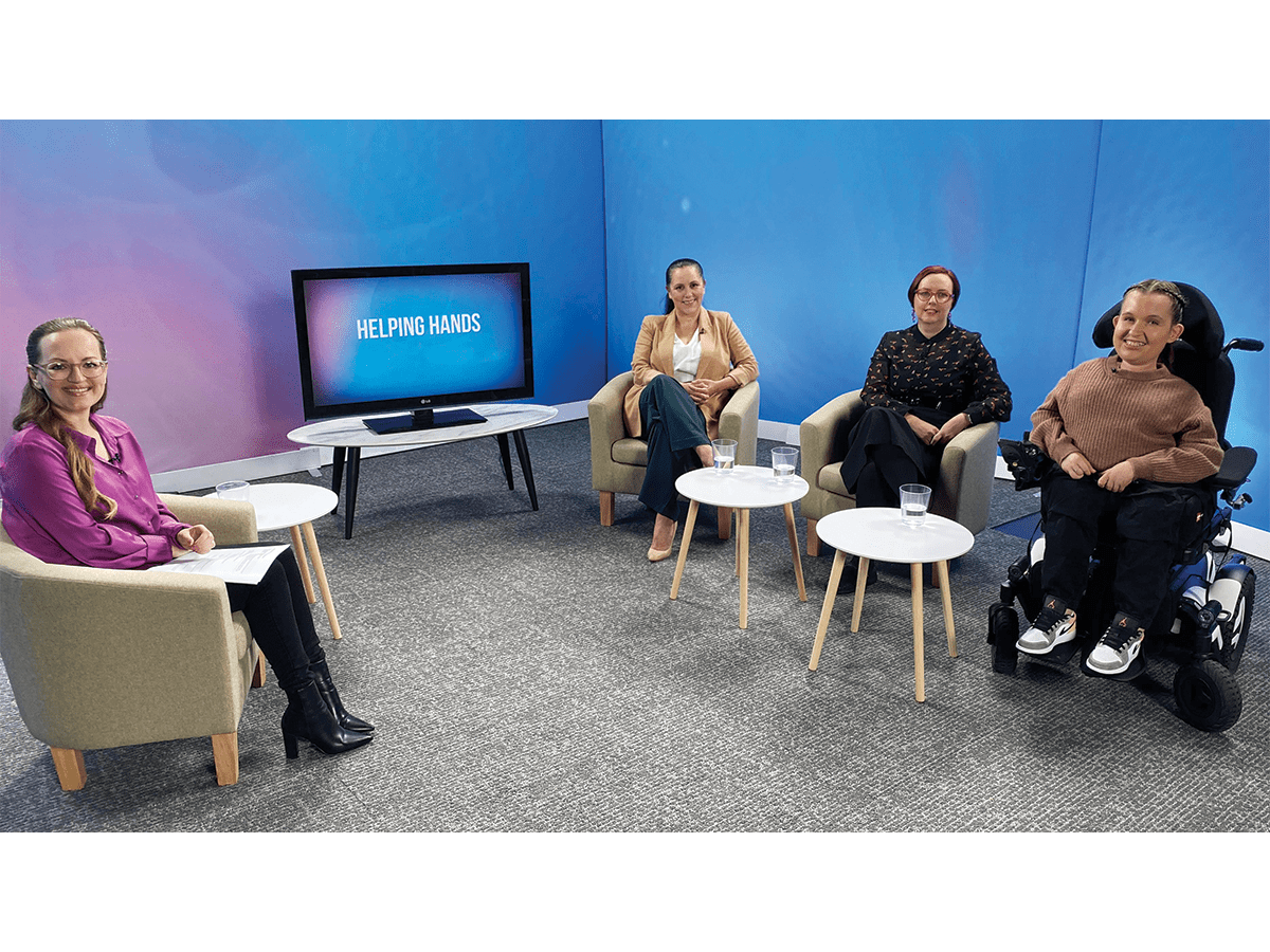 The panel for the Helping Hands TV show, including three people with disabilities and a moderator.