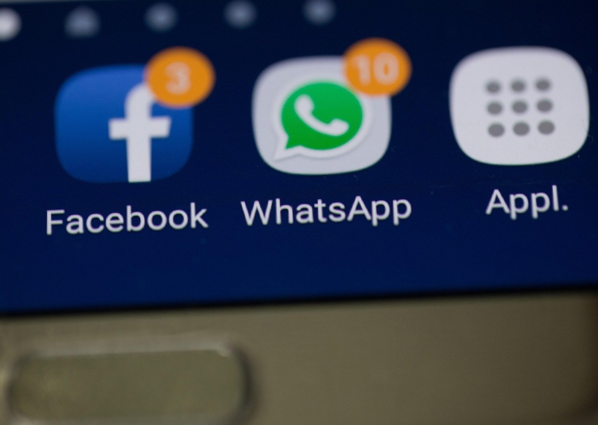 A screen showing two social media app icons, Facebook and Whatsapp.